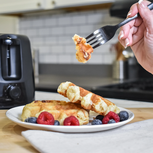 Traditional Liège waffles from Taste of Belgium, featuring caramelized pearl sugar and a golden crust.