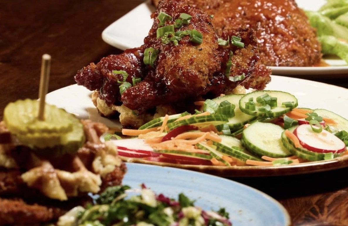 Chicken and Liège waffles with green onion garnish and side salad served at Taste of Belgium, Cincinnati brunch.