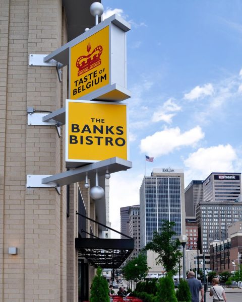 The Taste of Belgium logo displayed prominently at The Banks in Cincinnati, inviting guests to experience Belgian flavors.
