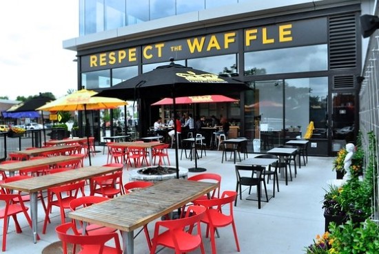 Couples dining on the outdoor patio at Taste of Belgium in Cincinnati during a romantic evening.