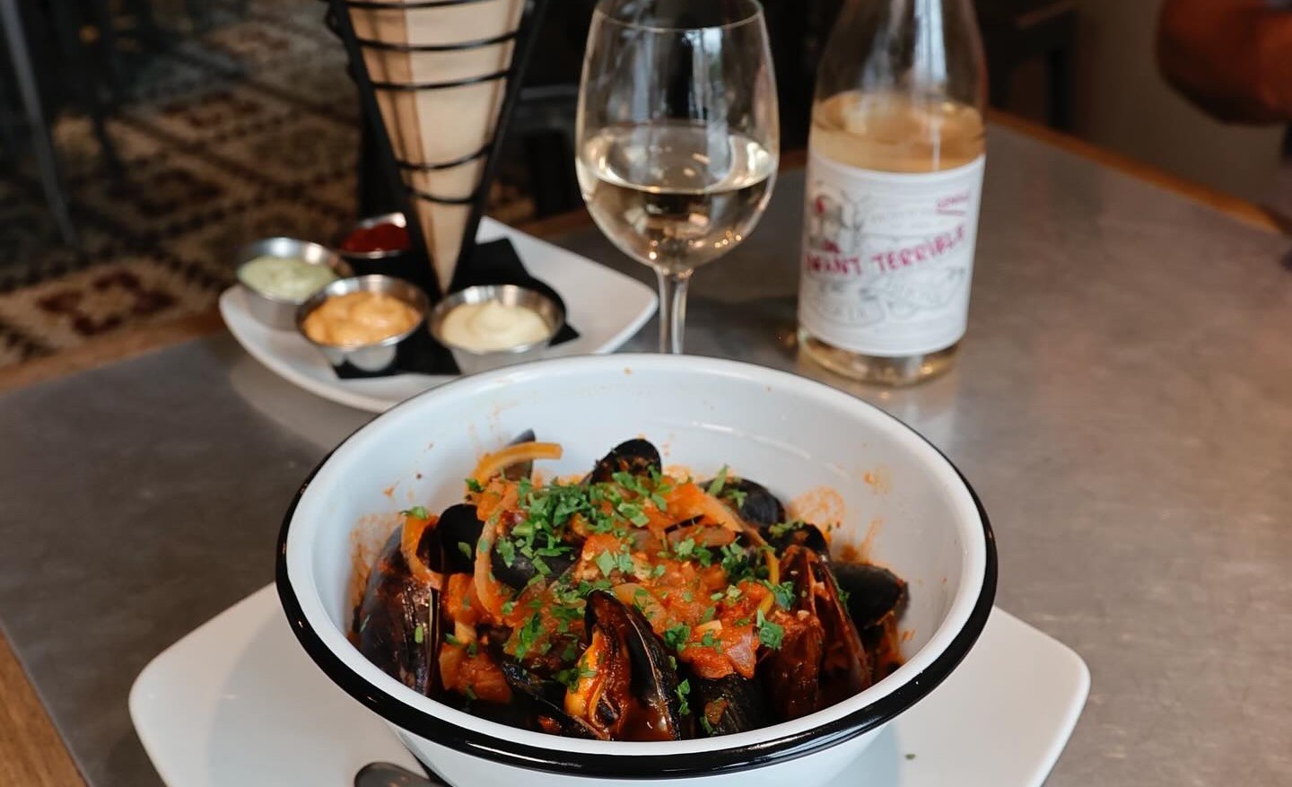 Brunch at Taste of Belgium, from savory mussels and crispy frites to a chilled glass of wine.